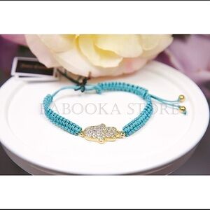 Juicy Couture Pave Hamsa Hand Friendship Bracelet.